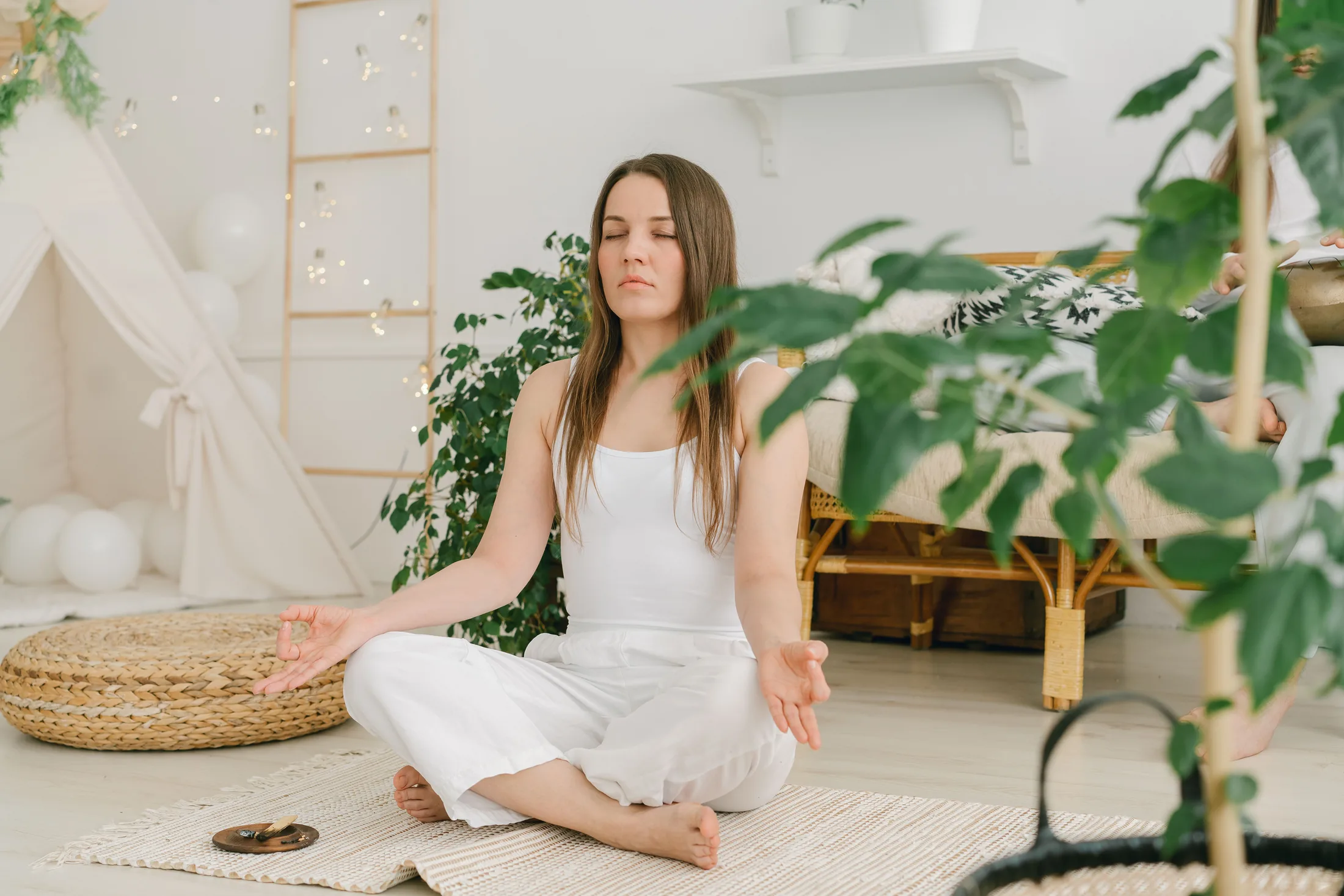 Adult practicing calm breathing in a comfortable home setting